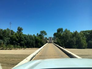 One lane bridge with a road train in front.