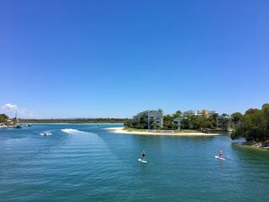 The canals of Noosa invite lots of water sports like stand-up paddling.